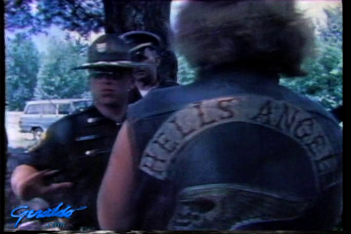 Hells Angels member with police officer, 1974